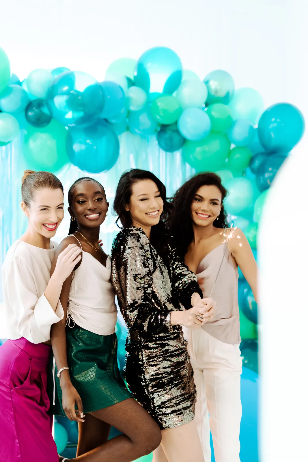 Friends posing at the photo booth