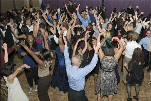 Guests dancing with hands up